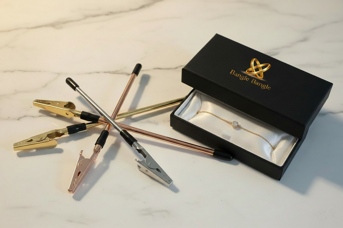 Gold, rose gold and silver Bangle Bangle Bracelet Helpers displayed together on a marble surface with Bangle Bangle gift box