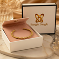 18K gold plated beaded cuff bangle in open Bangle Bangle white gift box with black trim and pink pouch, styled with candles and crystals — Bangle Bangle