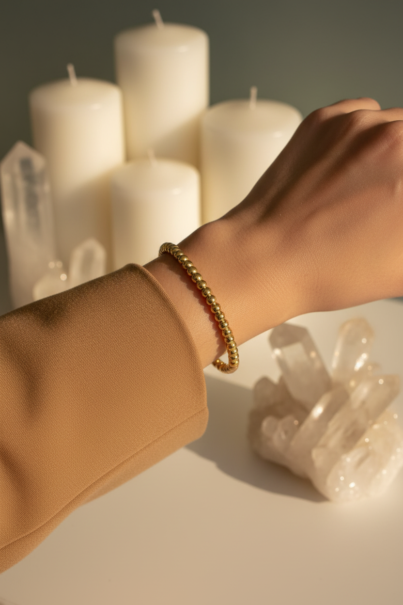 18K gold plated beaded cuff bangle with smooth polished round gold beads worn on a woman's wrist — Bangle Bangle