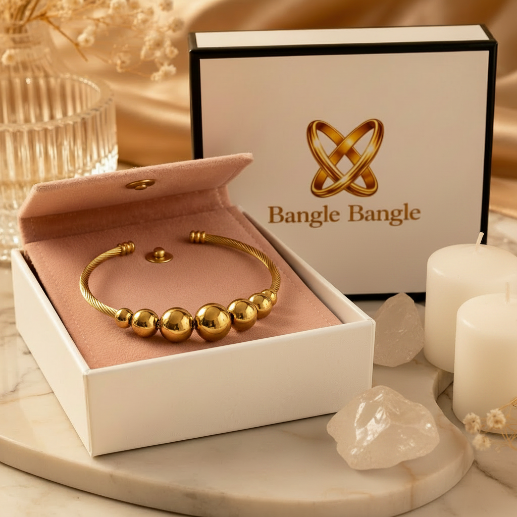 18K gold plated graduated ball cable cuff bangle in open Bangle Bangle white gift box with black trim and pink pouch, styled with candles and crystals — Bangle Bangle