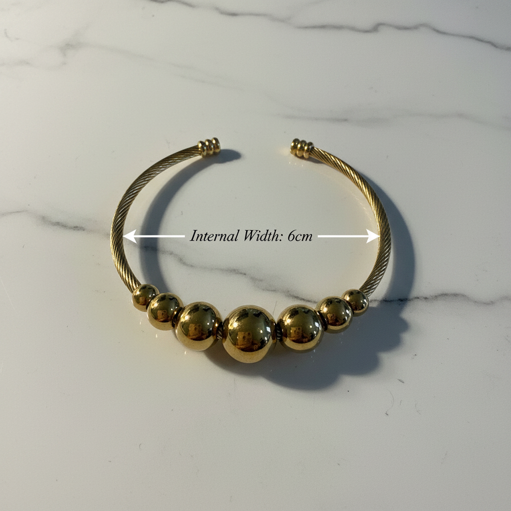 18K gold plated graduated ball cable cuff bangle photographed from above showing internal width of 6cm — Bangle Bangle