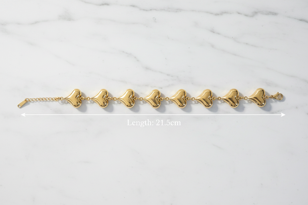 18K gold plated puffy heart chain bracelet laid flat showing full length of 21.5cm — Bangle Bangle