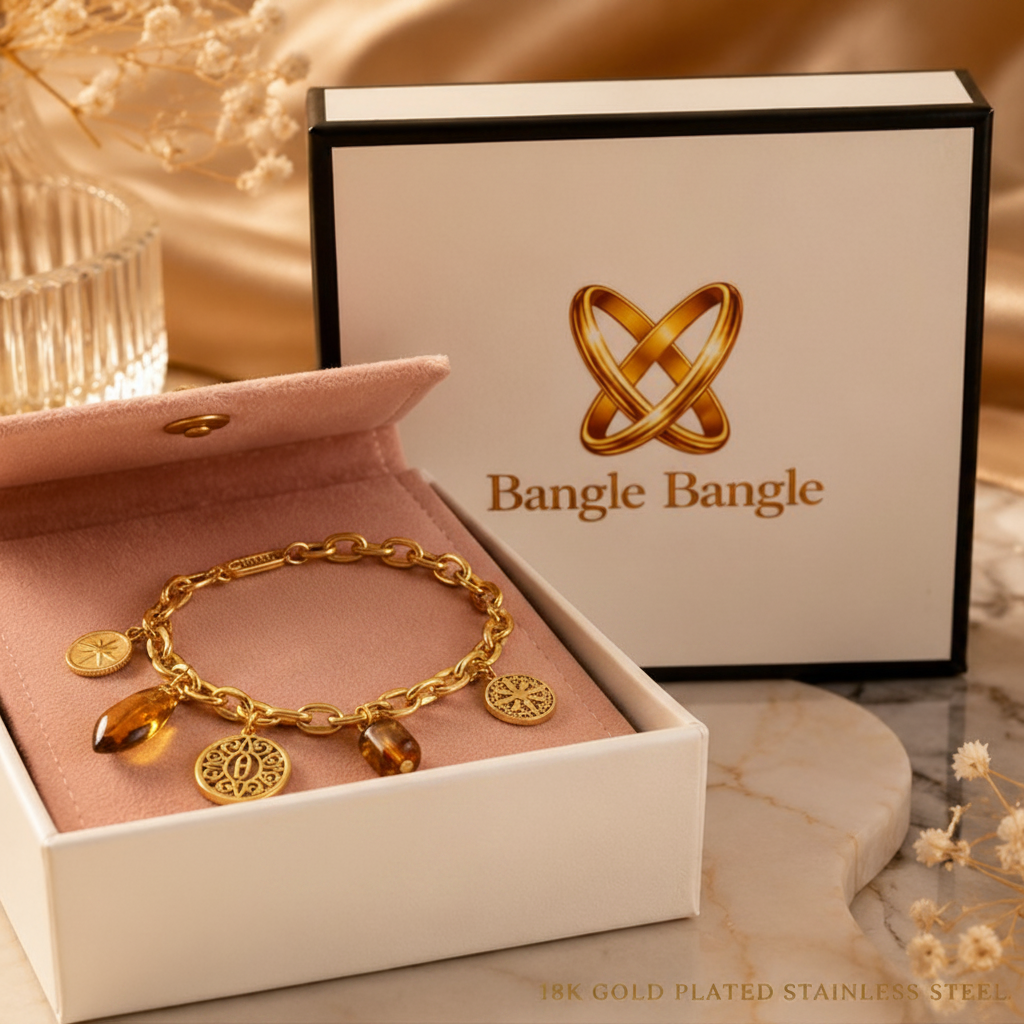 18K gold plated Roman charm bracelet resting in front of an open Bangle Bangle white gift box with black trim and pink pouch — Bangle Bangle
