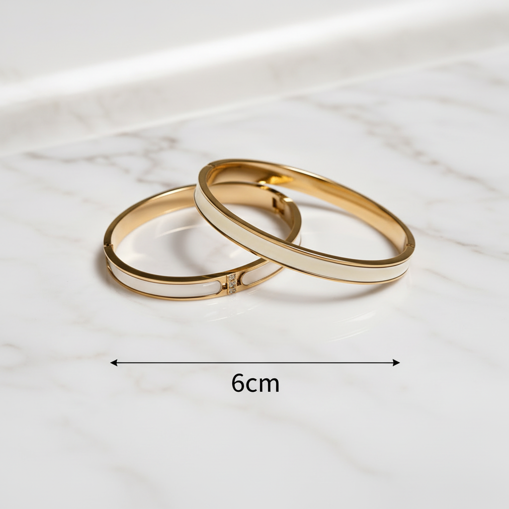 18K gold-plated white enamel inlay bangle set on marble surface with double-headed arrow showing 6cm internal width measurement